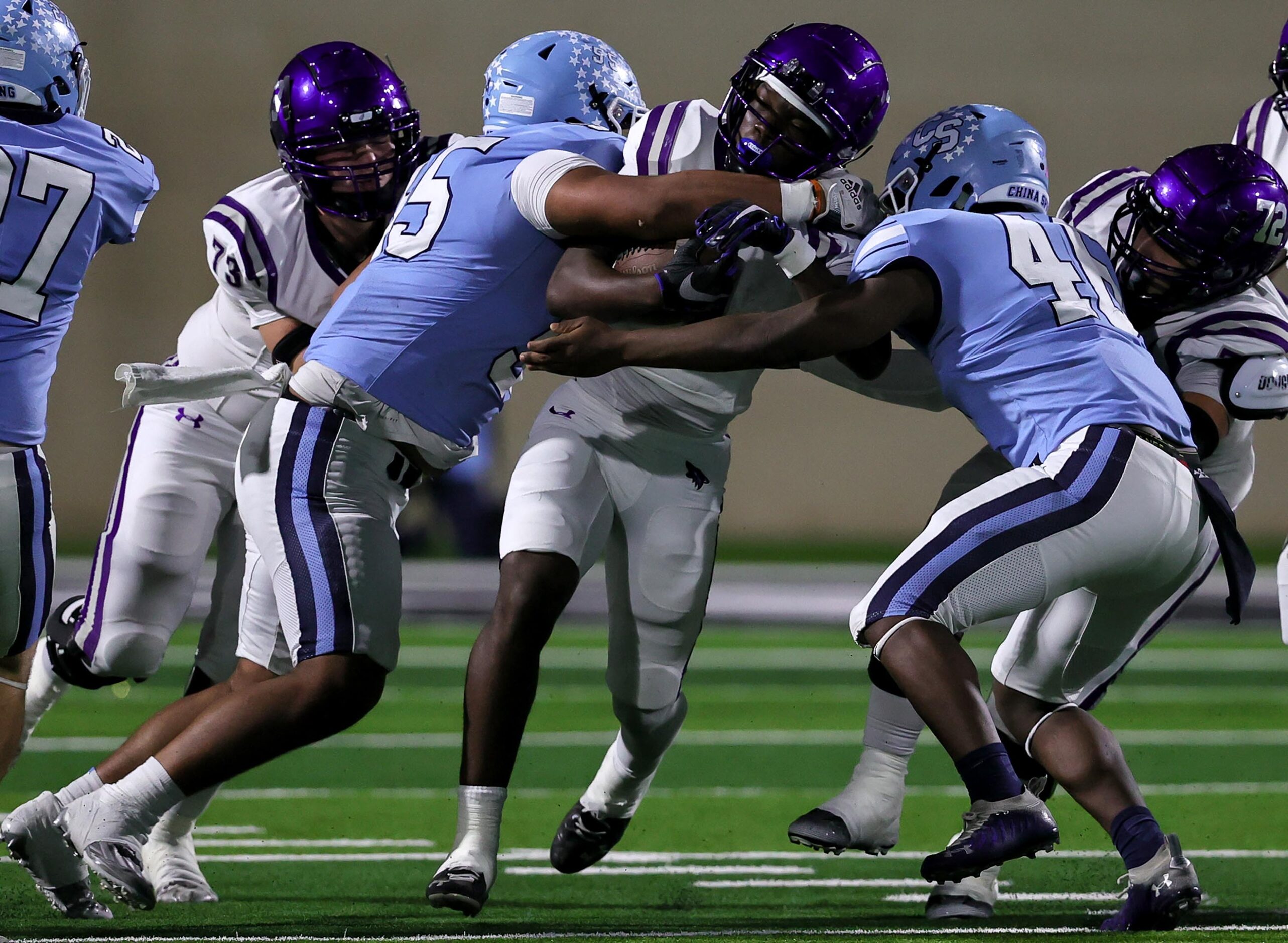 Anna running back Jambres Dubar (1) gets stopped by China Spring defensive lineman Greg...