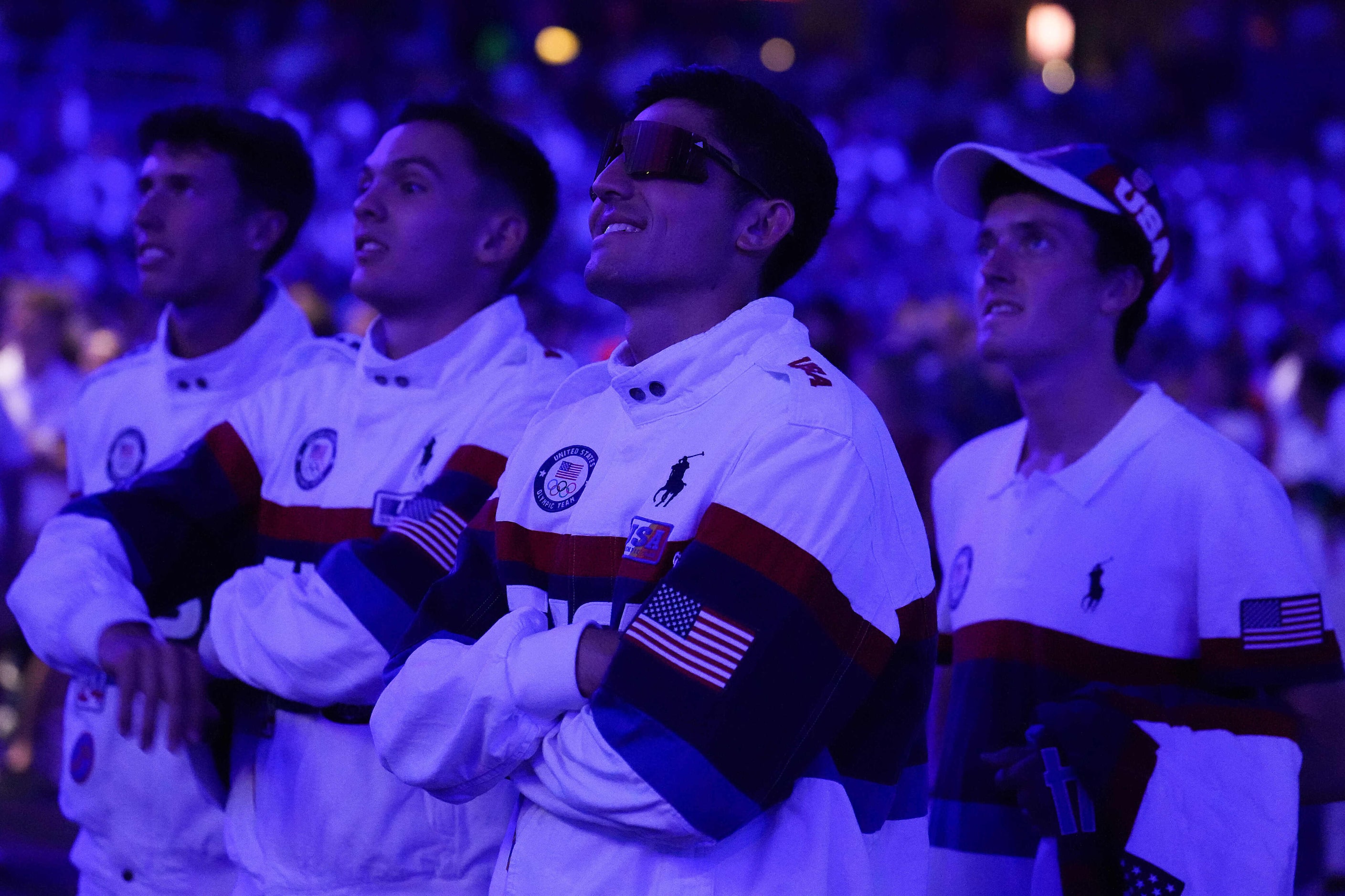 Bryce Hoppel of the United States (center) watches the Red Hot Chili Peppers perform on a...