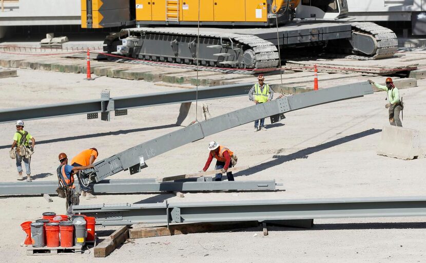 
Construction workers assembled girders at the construction site for The Star in Frisco on...