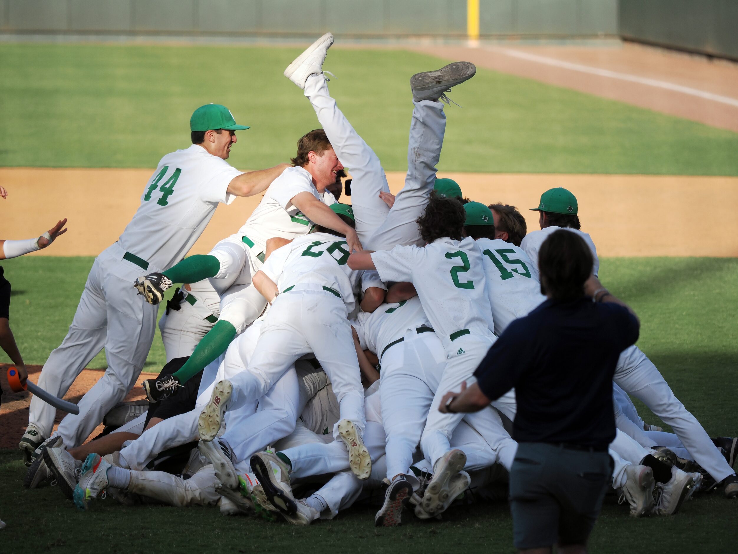 Southlake Carroll players react after defeating San Antonio Reagan in the UIL baseball 6A...