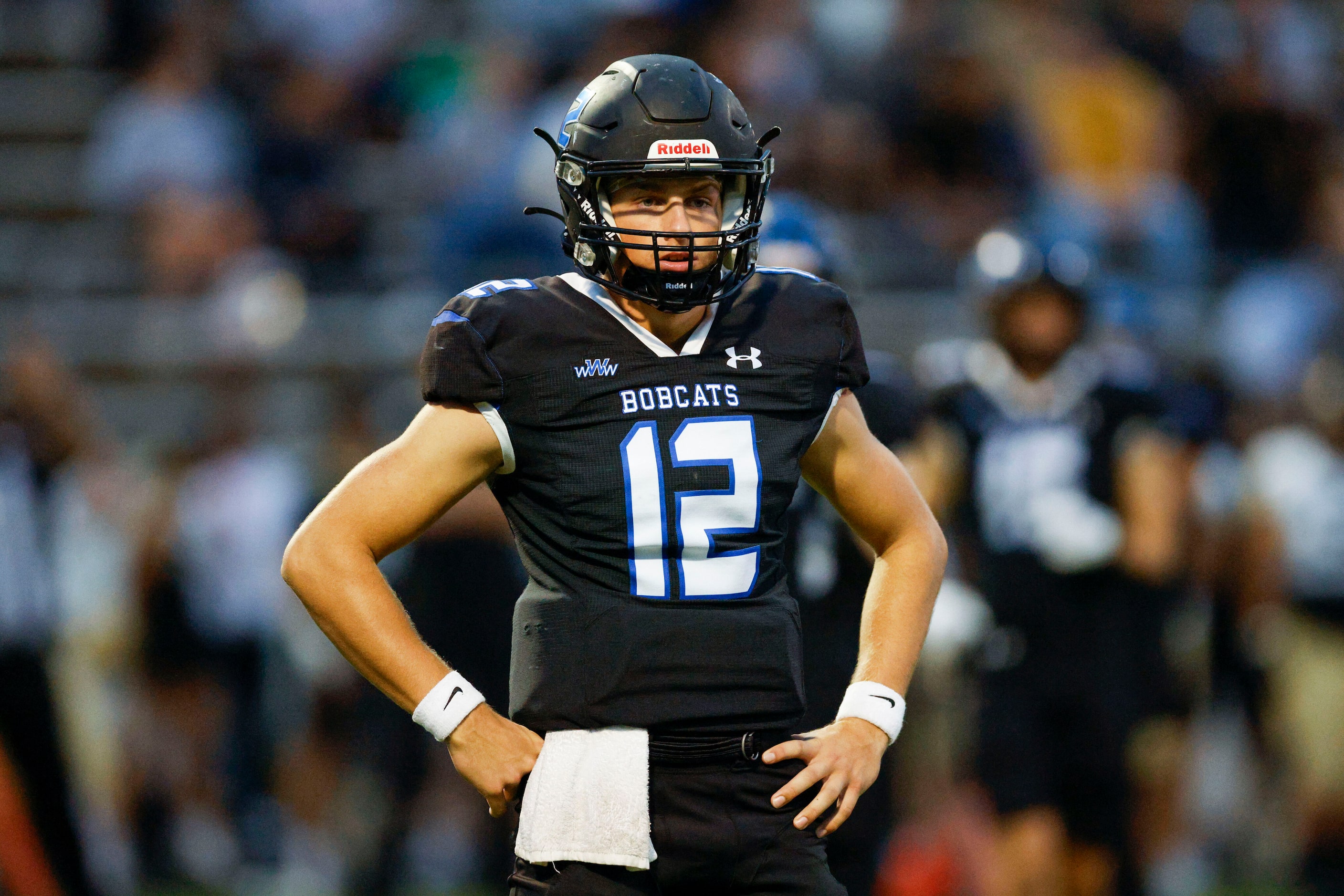 Trophy Club Byron Nelson TOm Von Grote (12) looks to the sideline for the play call during...