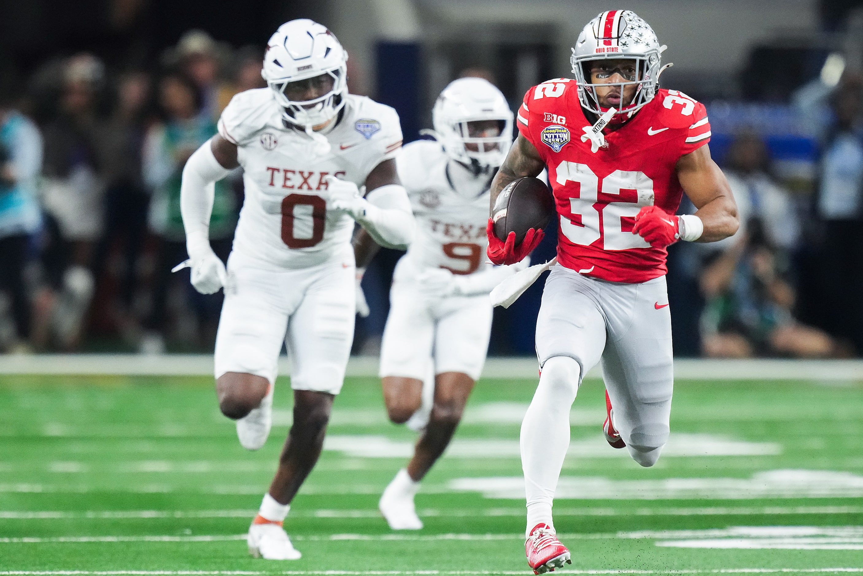 Ohio State running back TreVeyon Henderson (32) gets past Texas linebacker Anthony Hill Jr....