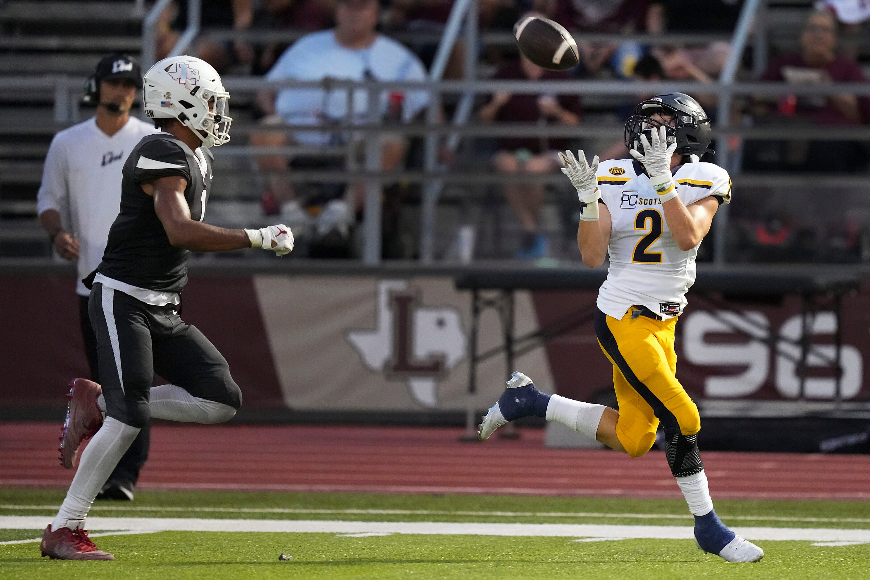 Highland Park wide receiver Grayson Schrank (2) hauls in a 69-yard touchdown pass as...