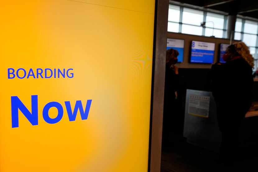 A display shows boarding in progress for a Southwest Airlines flight at Dallas Love Field on...
