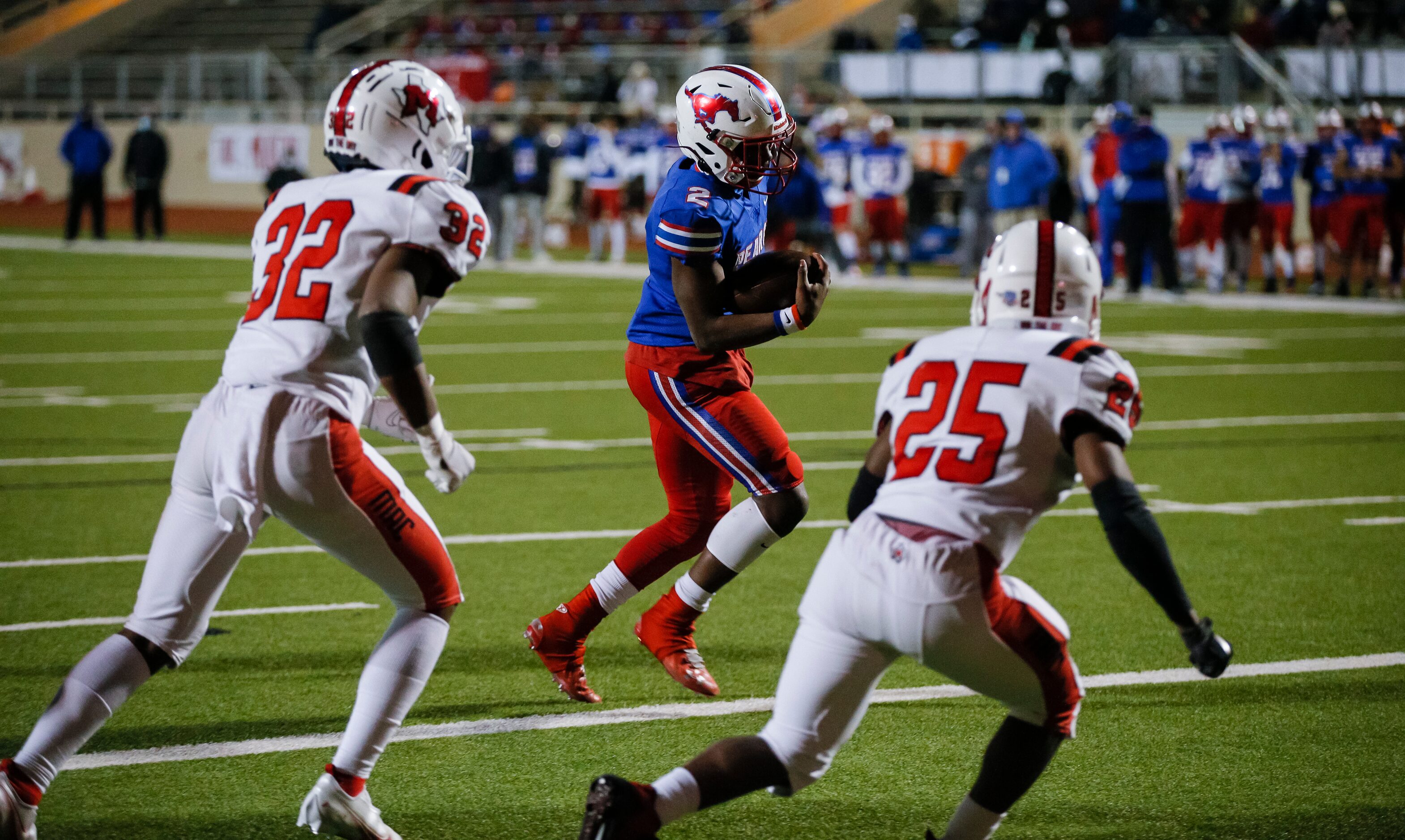 Irving MacArthur junior Aaron Reagan (32) and senior Kobe Bourne-Luke (25) defend as JJ...