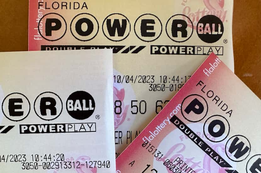 FILE - Powerball lottery tickets