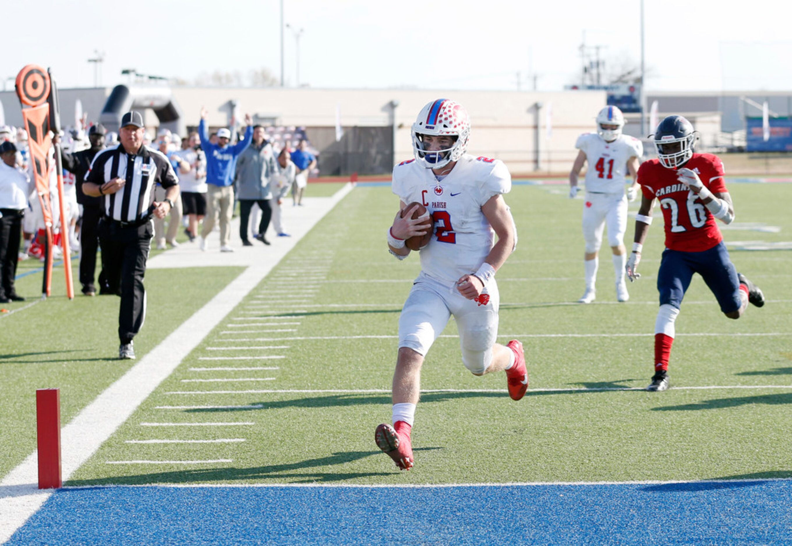 Parish Episcopal's Preston Stone (2) scores a touchdown in front of Plano John Paul II's...