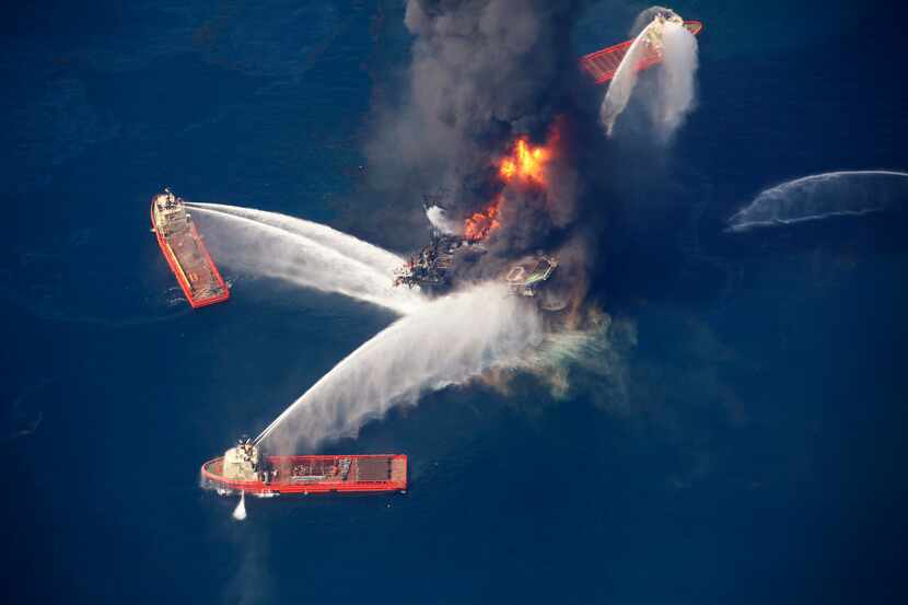 FILE - In this April 21, 2010, file photo, the Deepwater Horizon oil rig burns in the Gulf...