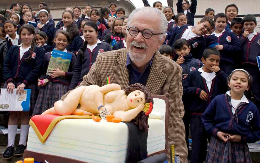 FILE - Colombian artist Fernando Botero laughs next to a cake decorated with a pastry in the...