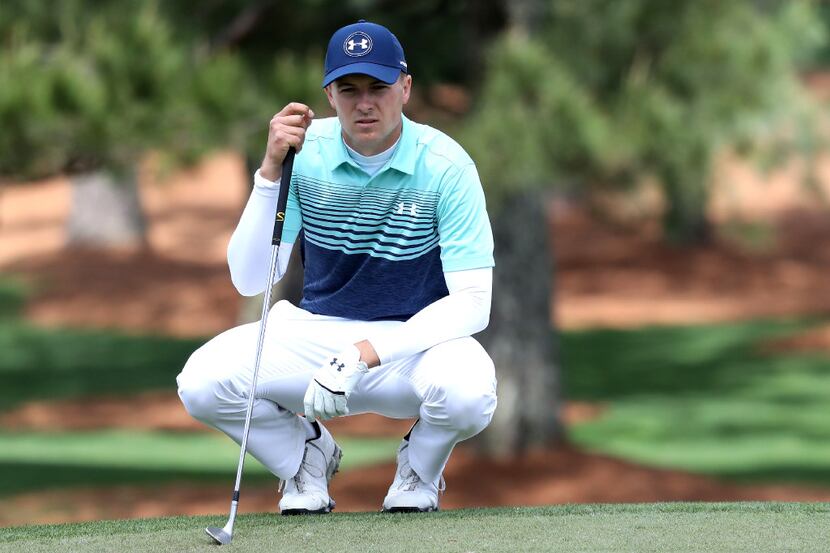 AUJordan Spieth lines up his putt on the seventh hole during the first round of the 2017...