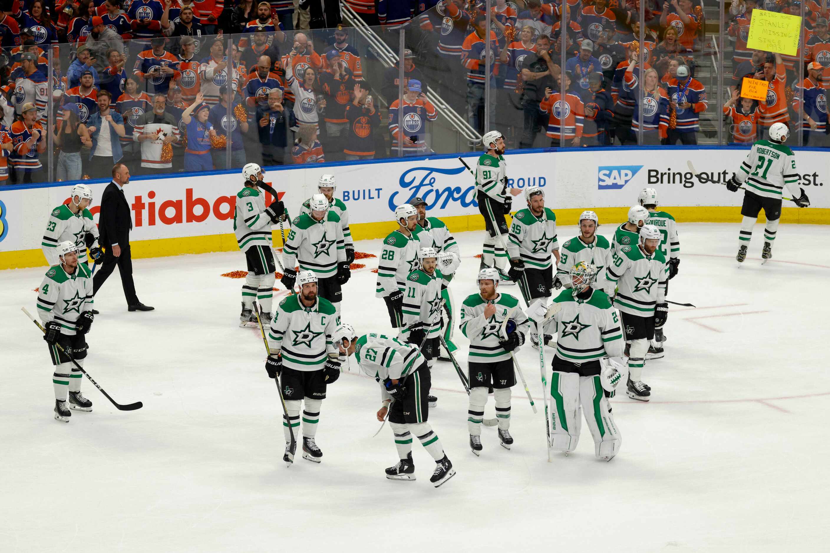 The Dallas Stars stand on the ice after losing Game 6 of the Stanley Cup Western Conference...