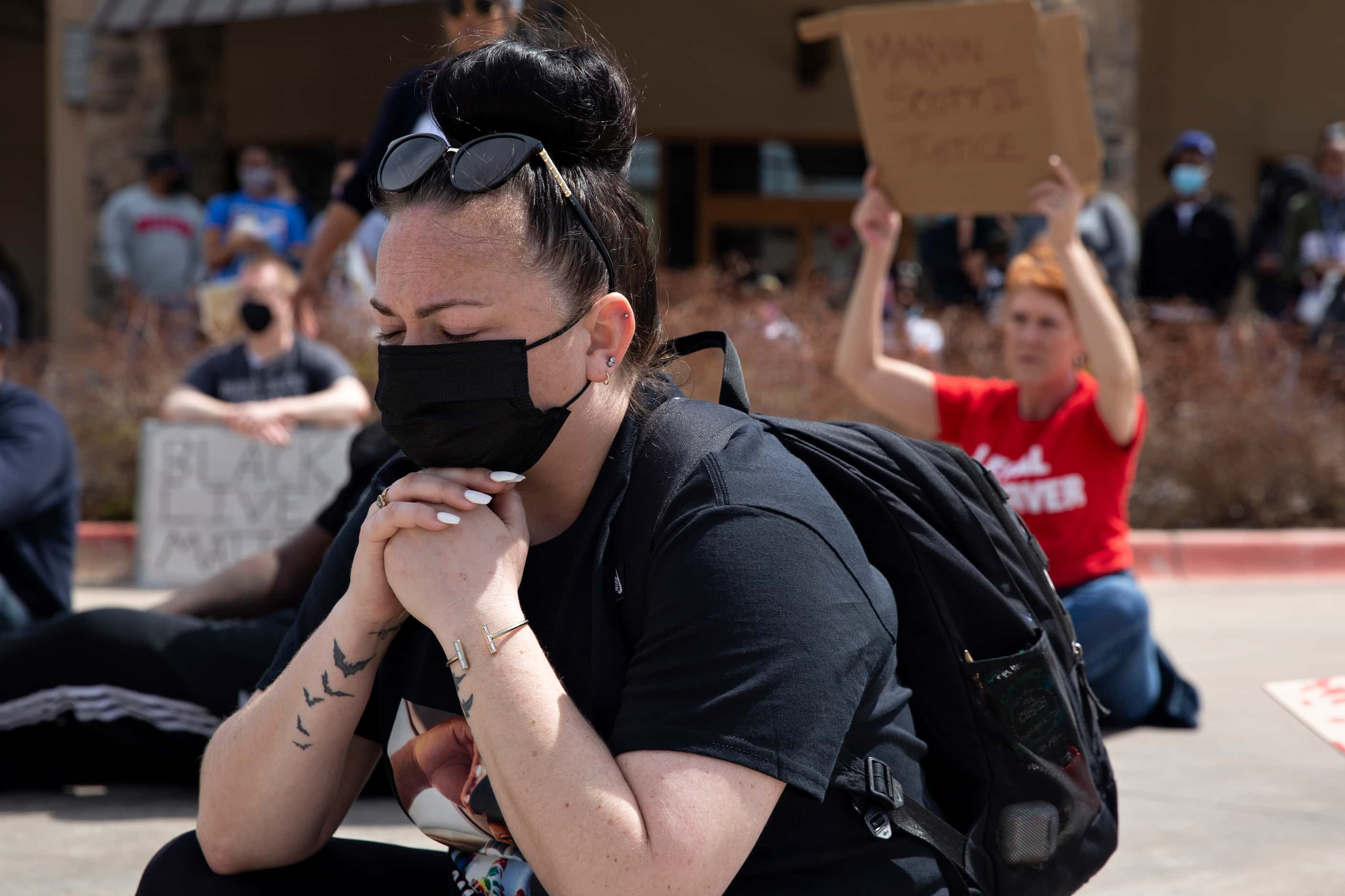 Lisa Better takes a moment as demonstrators chant and occupy an intersection in the Allen...