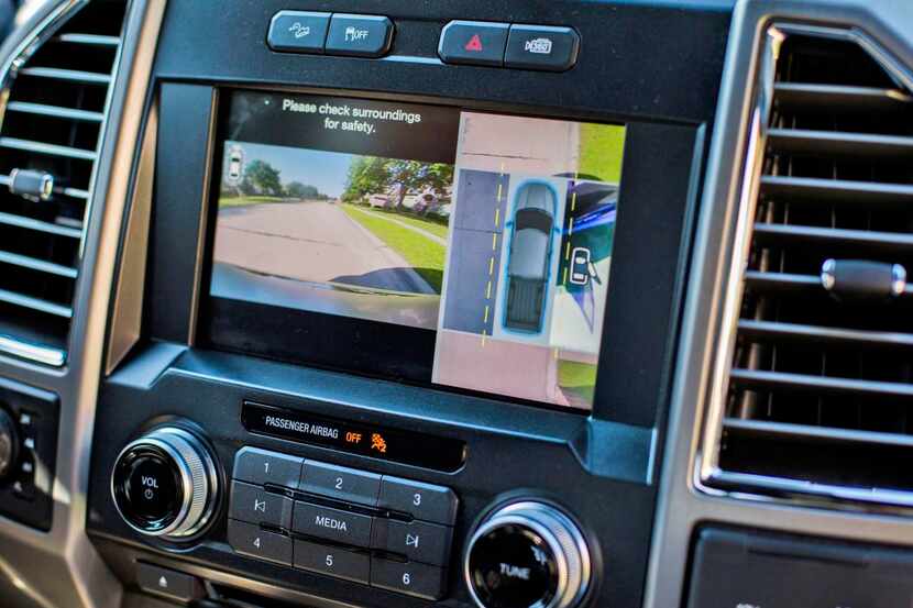 
A touch screen in Tim Wiford’s 2015 Ford F150 Platinum pickup truck shows a 360-degree view...