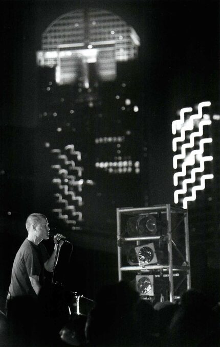 Against the Dallas skyline, MC 900 FT Jesus performs on the night of Sunday June 22, 1992. 