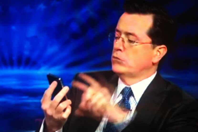 Comedian Stephen Colbert interacts with Siri the iPhone assistant.