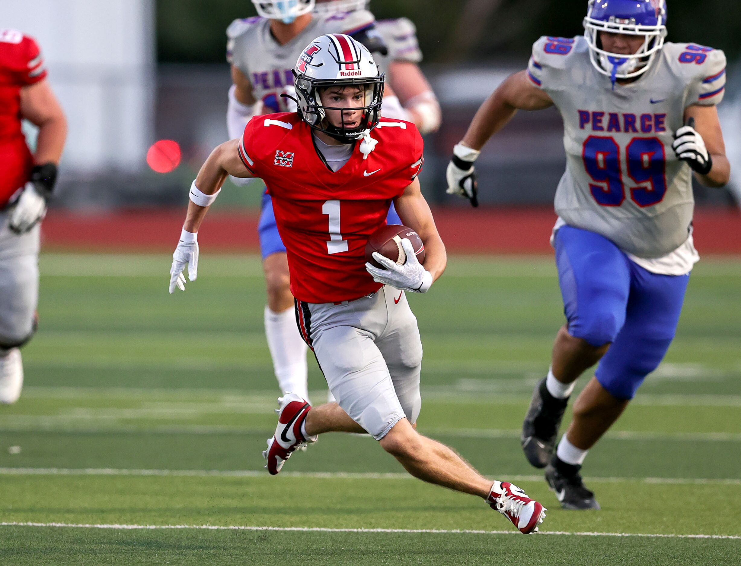 Flower Mound Marcus wide receiver Charlie Bergeson (1) has a lot of room to run against...