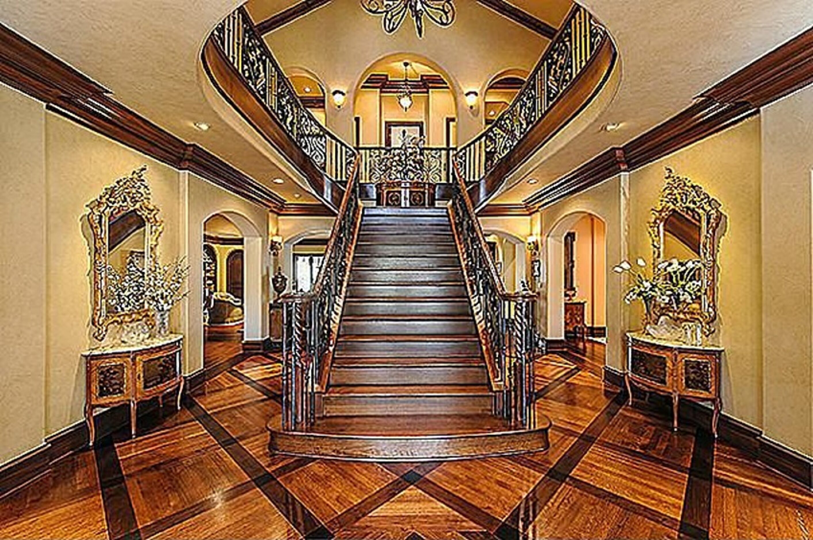 The home includes a two story formal foyer with a split staircase and an in house elevator.