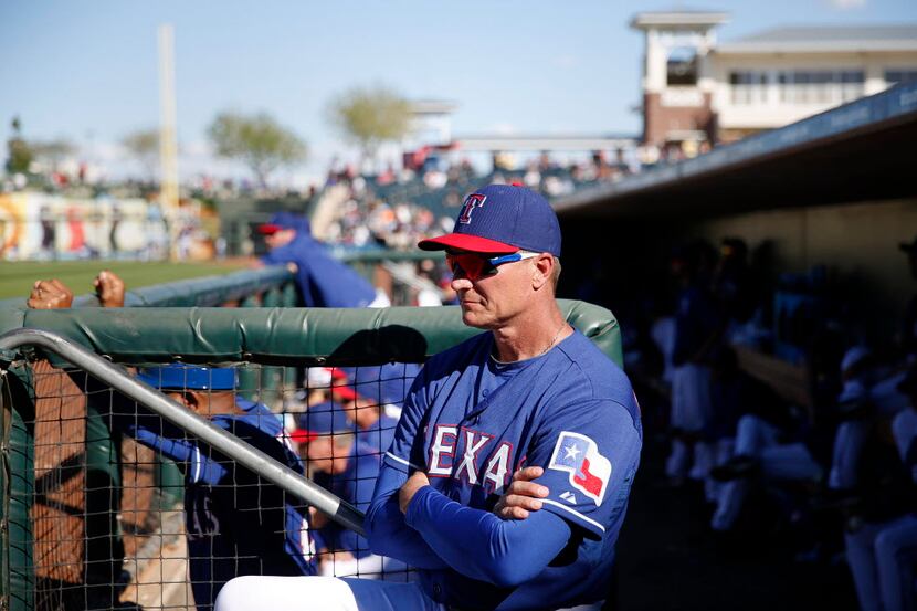 Texas Rangers manager Jeff Banister watches form the dugout during a Major League Baseball...