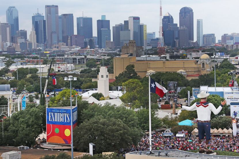 A crowd gathers for the opening ceremony next to the new Big Tex on the first day of the...