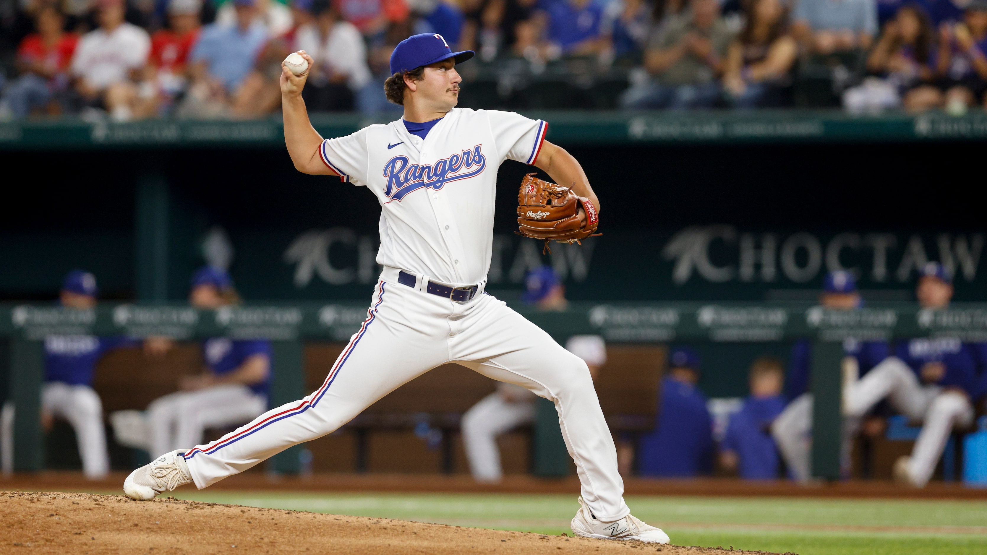 Texas Rangers relief pitcher Owen White (43) delivers a pitch in his major league debut...