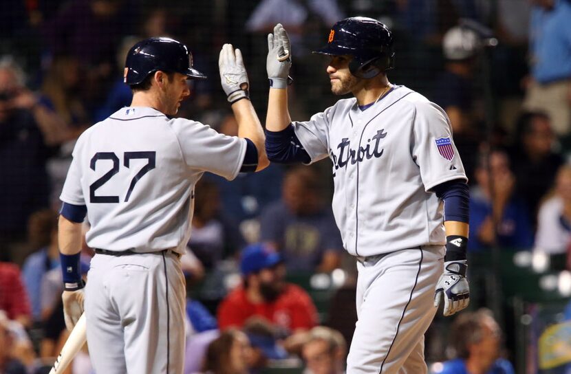 Aug 19, 2015; Chicago, IL, USA; Detroit Tigers right fielder J.D. Martinez (right)...