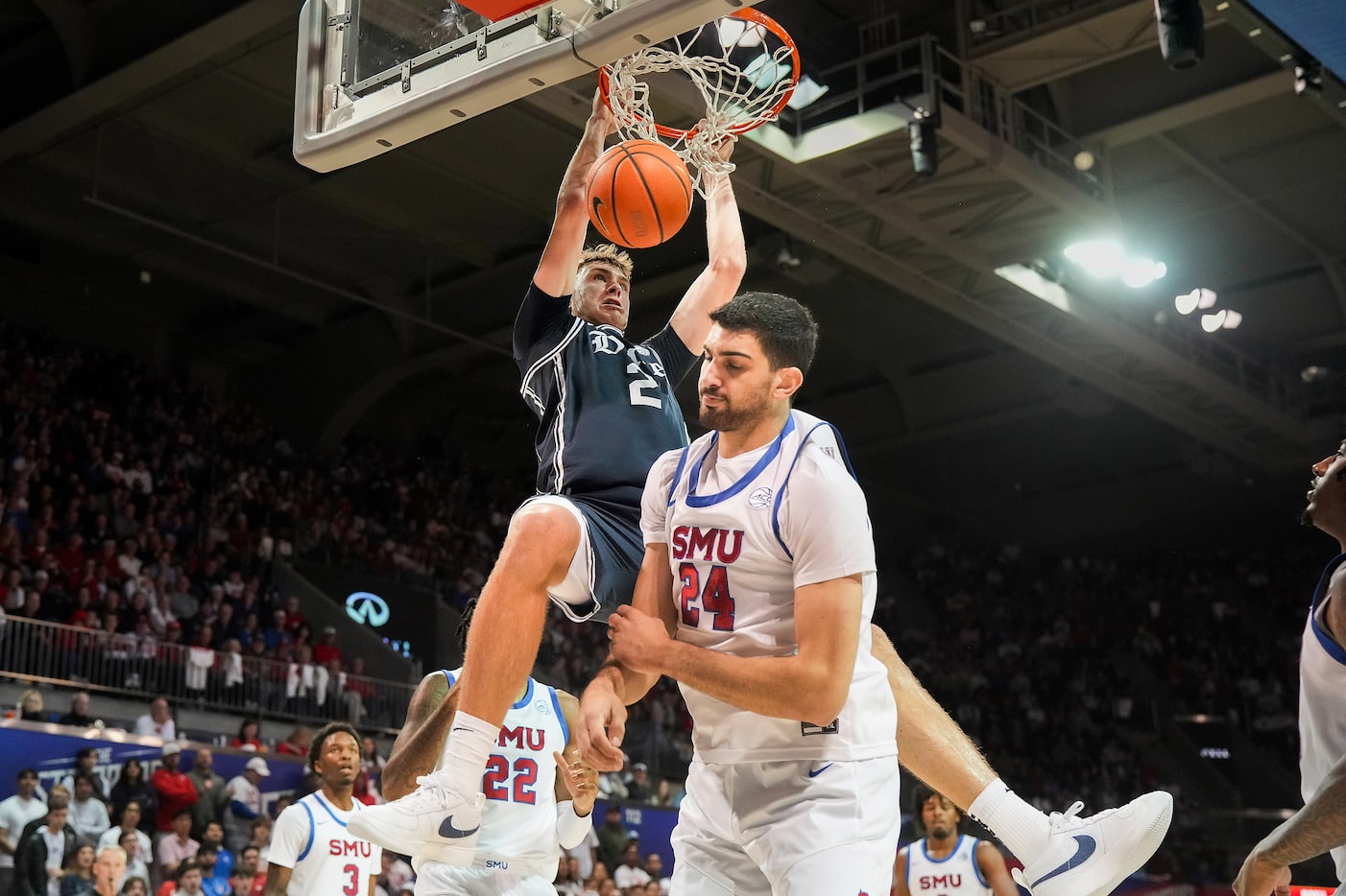 Duke guard Cooper Flagg (2) dunks past SMU center Samet Yigitoglu (24) during the first half...