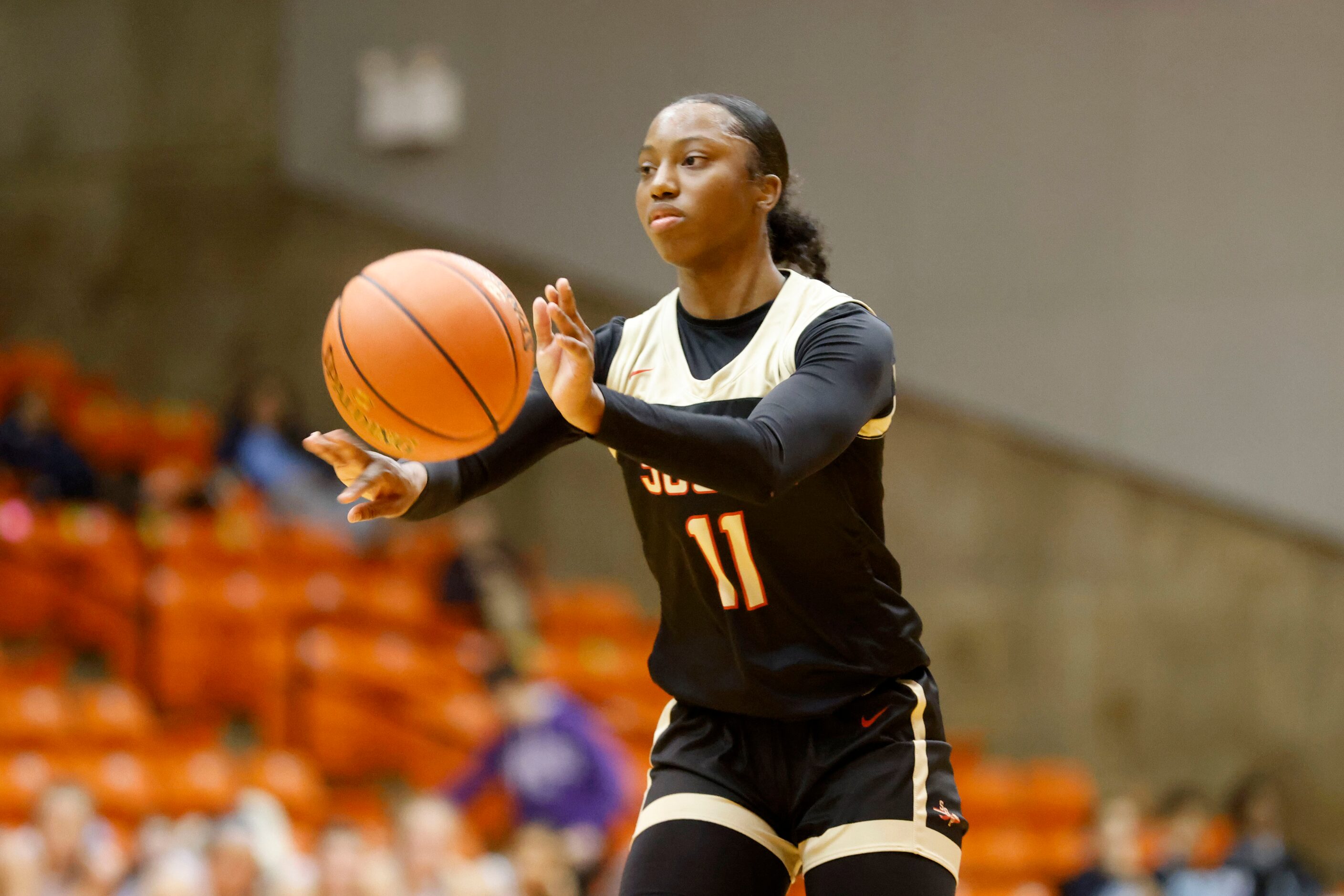 South Grand Prairie’s Jahclyn Hartfield passes the ball as they played Southlake Carroll...