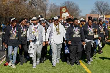 South Oak Cliff head coach Jason Todd leads the South Oak Cliff team to the stage before a...