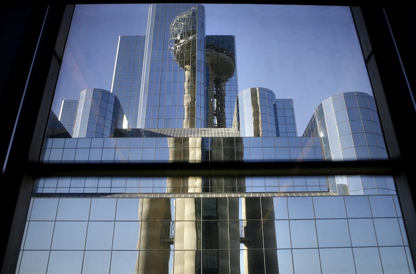 Reunion Tower is reflected in window panes of the Hyatt Regency hotel in downtown Dallas in...