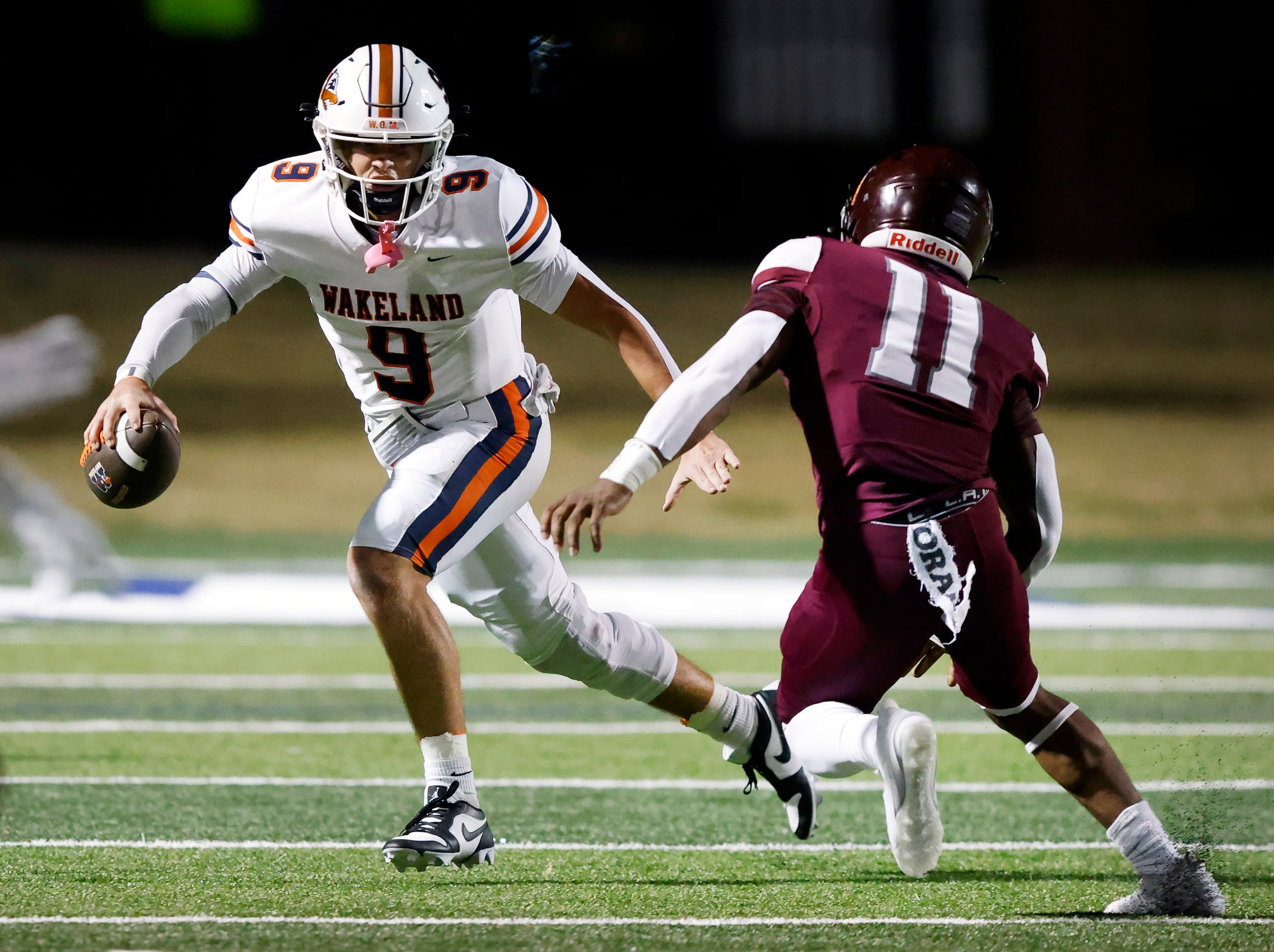 Frisco Wakeland quarterback Brennan Myer (9) eludes Mansfield Timberview linebacker Kingsley...