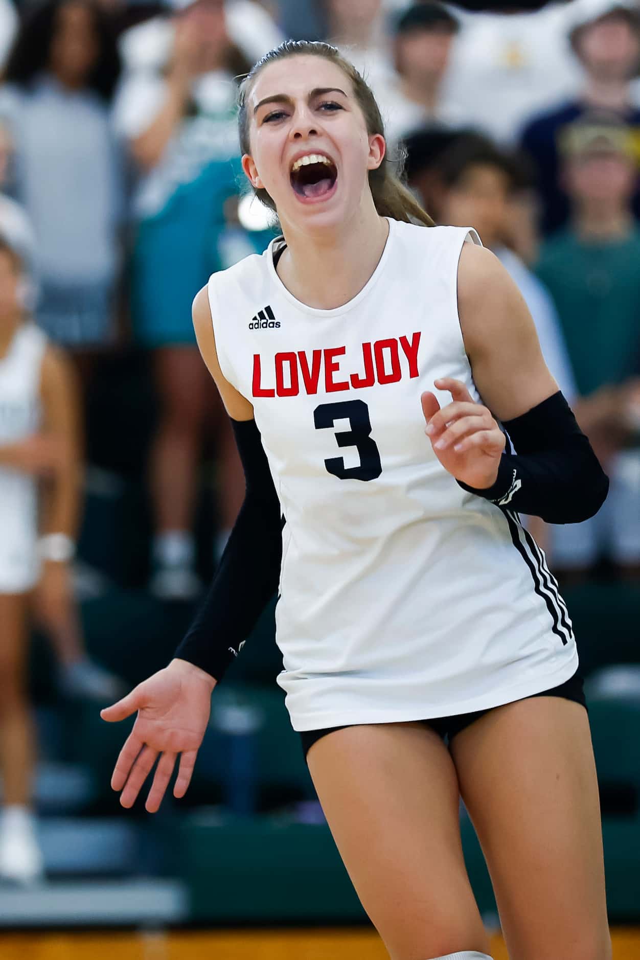 Love Joy senior libero McKenna Brand celebrates a point during a high school volleyball...