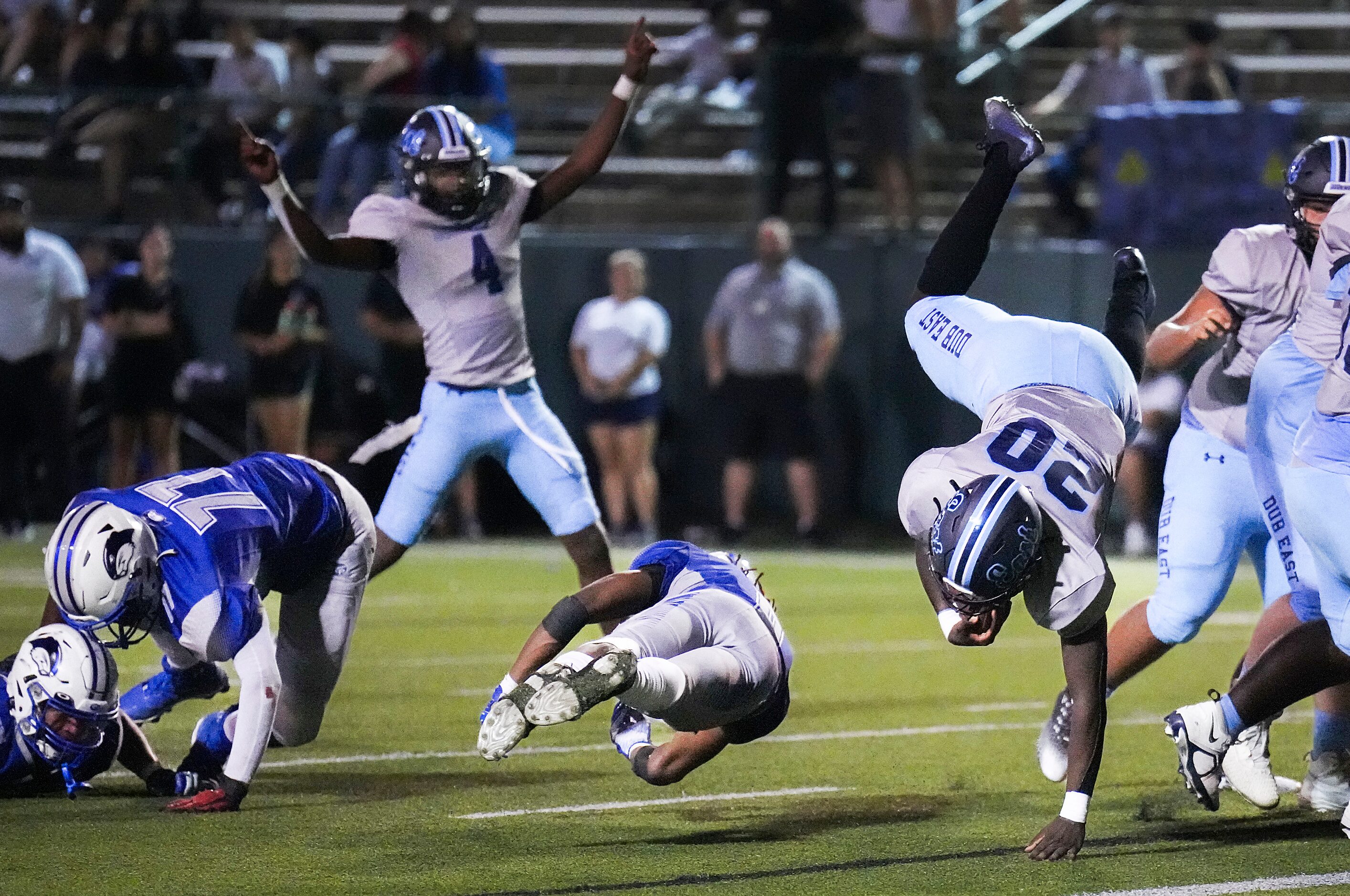 Wylie East running back Keshaun Scott (20) flips into the end zone past Grand Prairie...