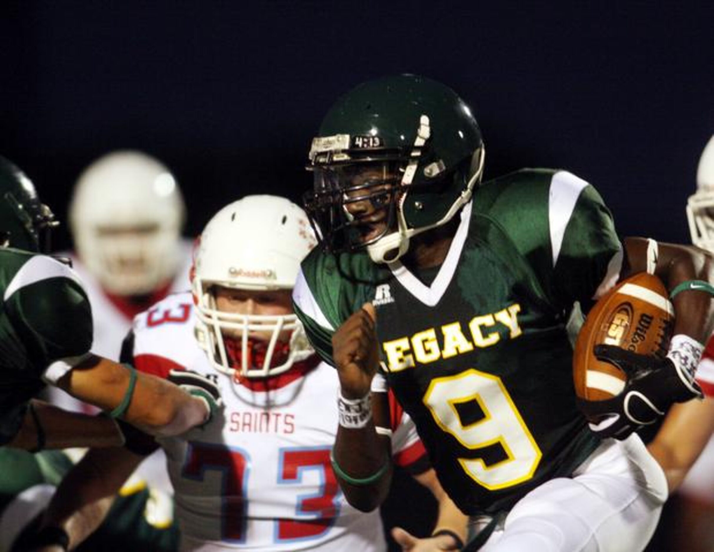 Frisco Legacy Christian quarterback Joshua Atkinson (right) looks for running room against...