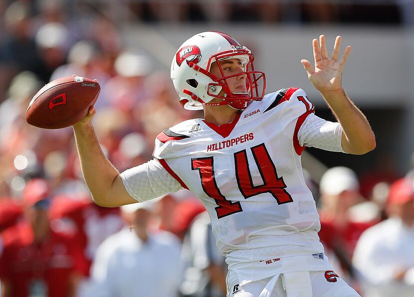 TUSCALOOSA, AL - SEPTEMBER 10:  Mike White #14 of the Western Kentucky Hilltoppers looks to...