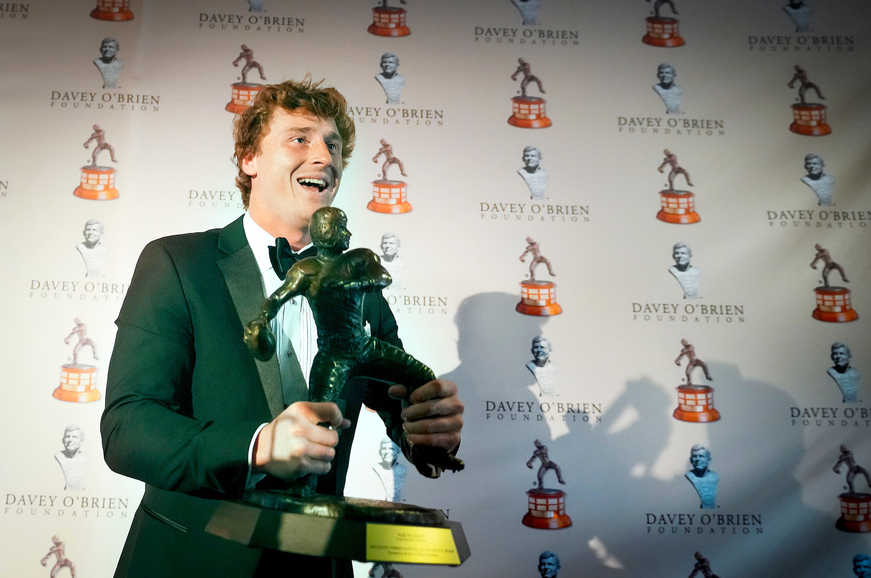 TCU quarterback Max Duggan lifts the Davey O'Brien Award, given to College Football’s best...