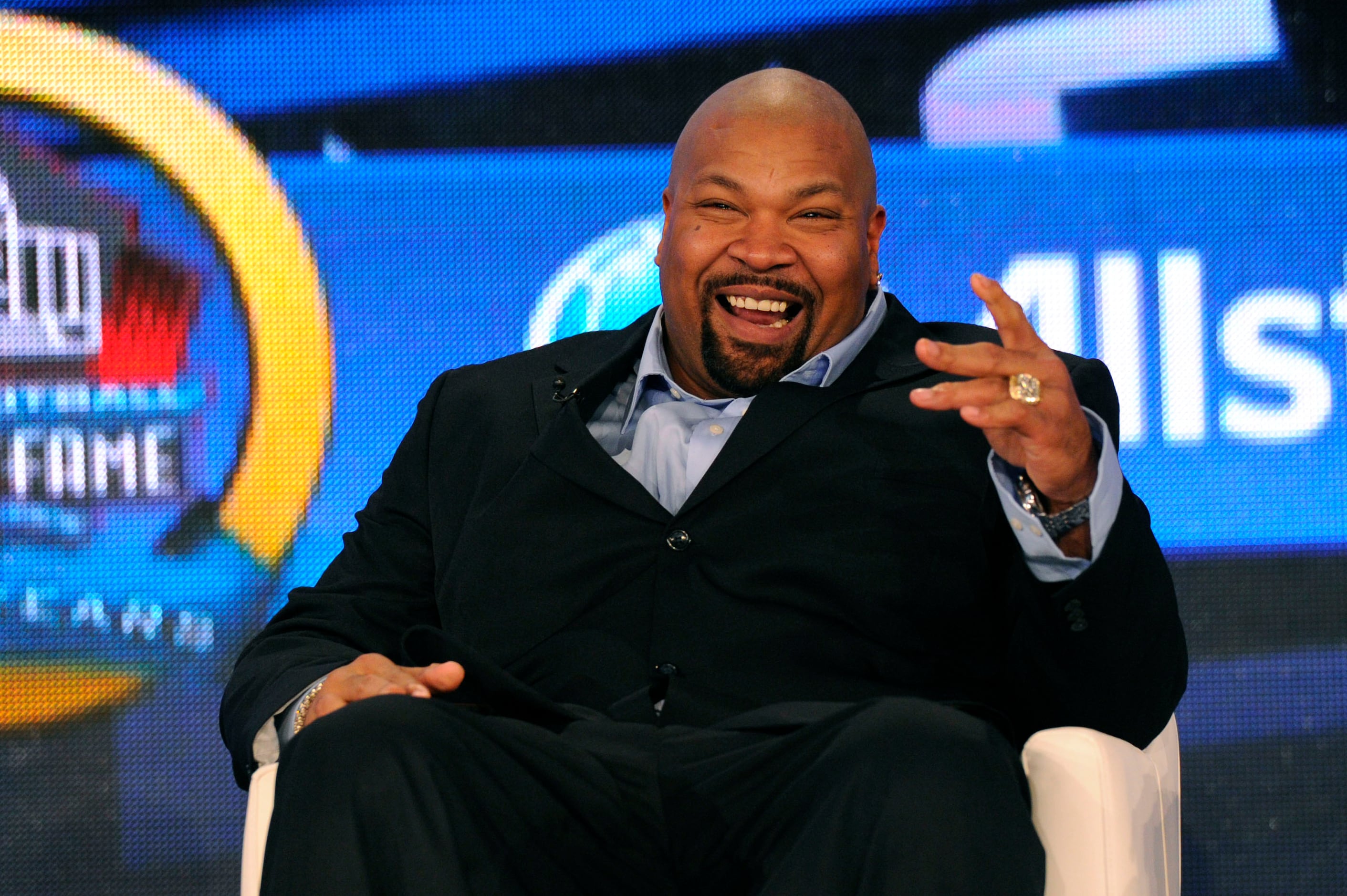 Larry Allen of the San Francisco 49ers laughs in the locker room