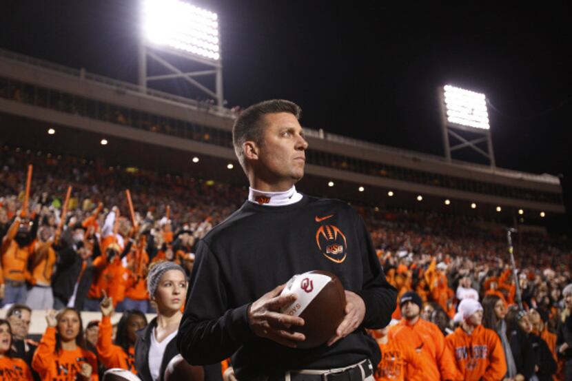 Mike Gundy played quarterback for Oklahoma State in the 1980s before taking over as head...