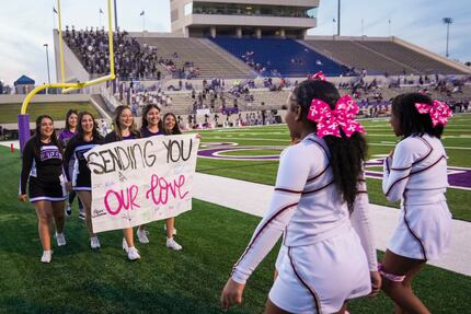 Mansfield Timberview cheerleaders (right) are met by their counterparts from Waco University...