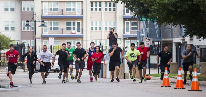 Dallas police candidates ran a 300-meter time trial while undergoing physical tests...