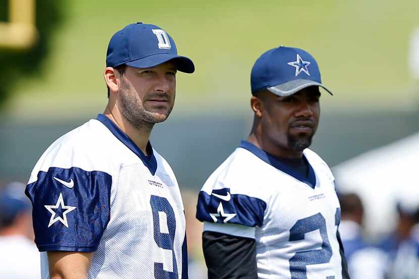 Dallas Cowboys quarterback Tony Romo (9) and running back Ezekiel Elliott (23) watch as...