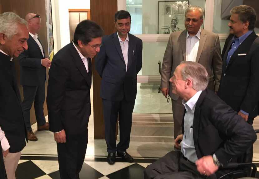 Texas Gov. Greg Abbott is greeted at Mahindra Group headquarters in Mumbai, India, on Sunday...