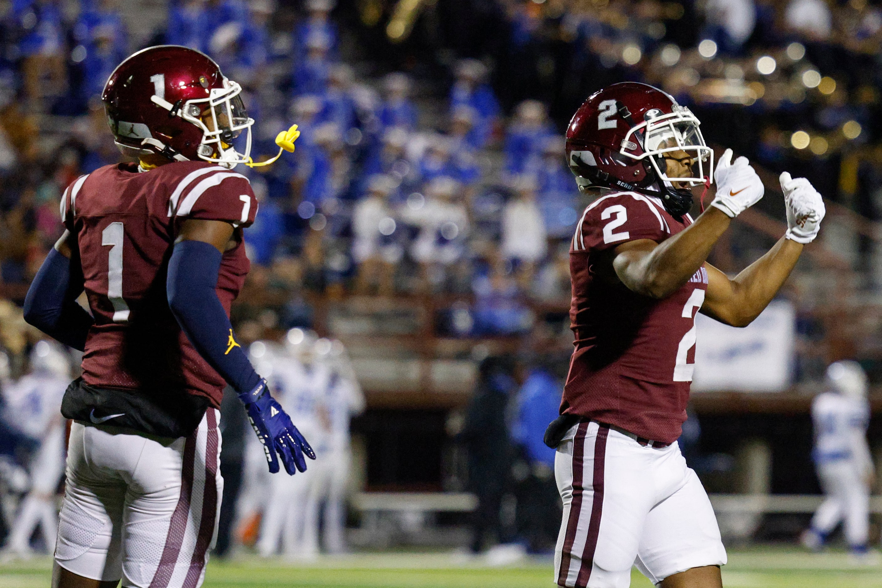 Red Oak wide receiver Brayden Robinson (2) celebrates with wide receiver Taz Williams Jr....