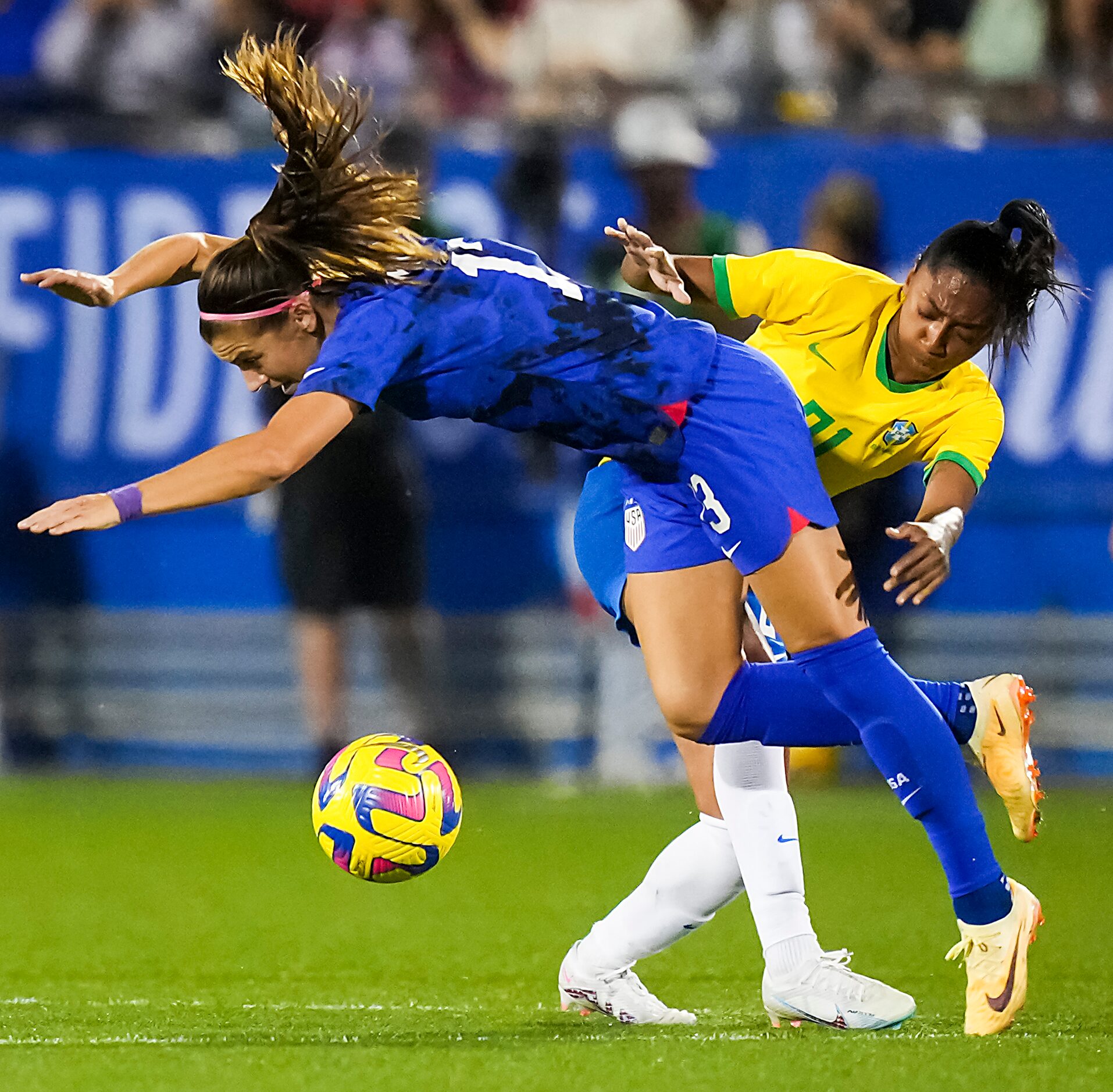 United States forward Alex Morgan (13) is brought down by Brazil midfielder Kerolin (21),...