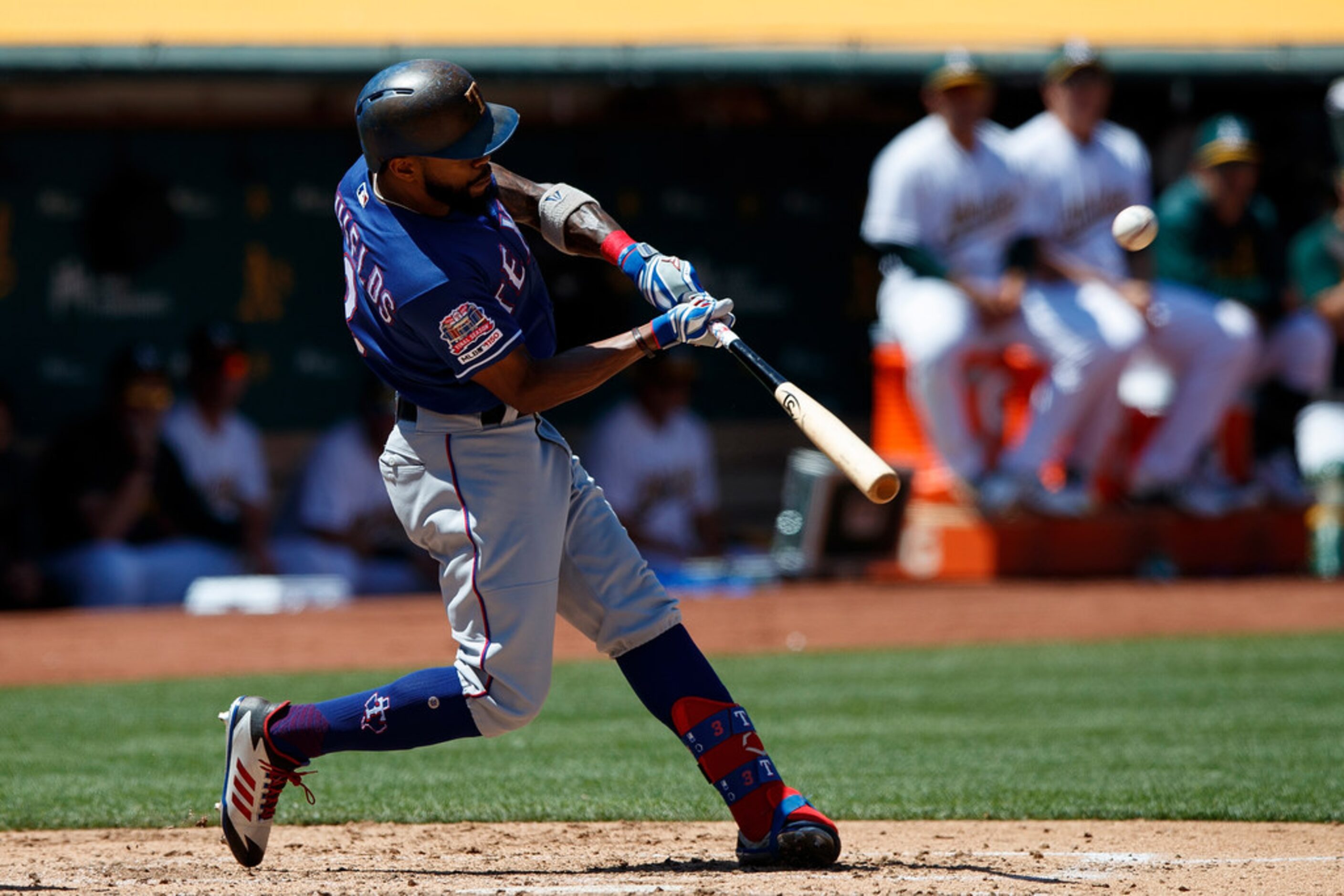 OAKLAND, CA - JULY 28:  Delino DeShields #3 of the Texas Rangers hits a triple against the...