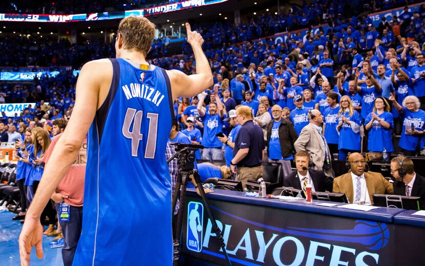 Dallas Mavericks forward Dirk Nowitzki (41) gives the Oklahoma City Thunder crowd a thumbs...