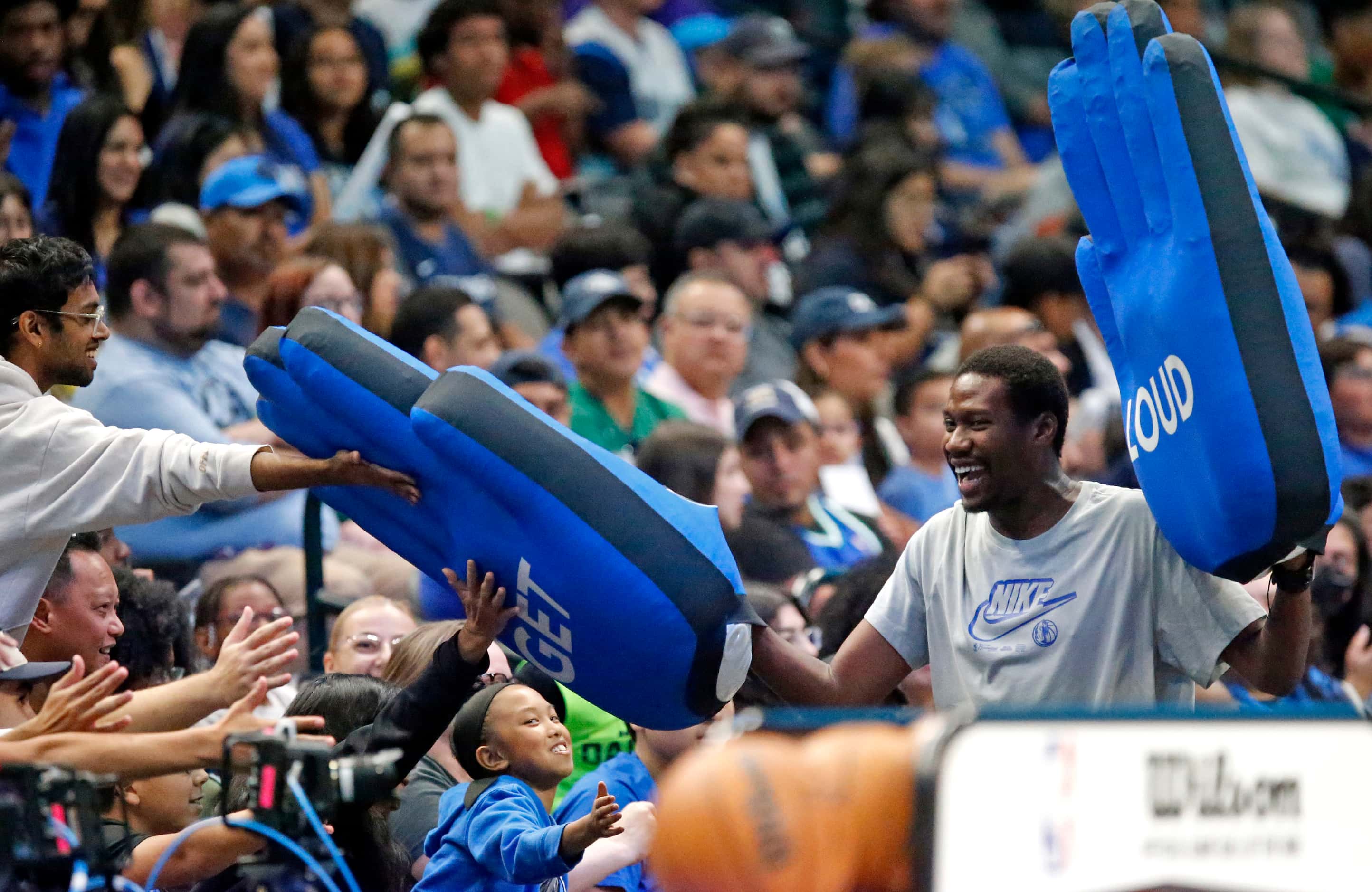Mavs cheer personel work the crowd before the team takes the court at the Mavs Fan Jam, a...