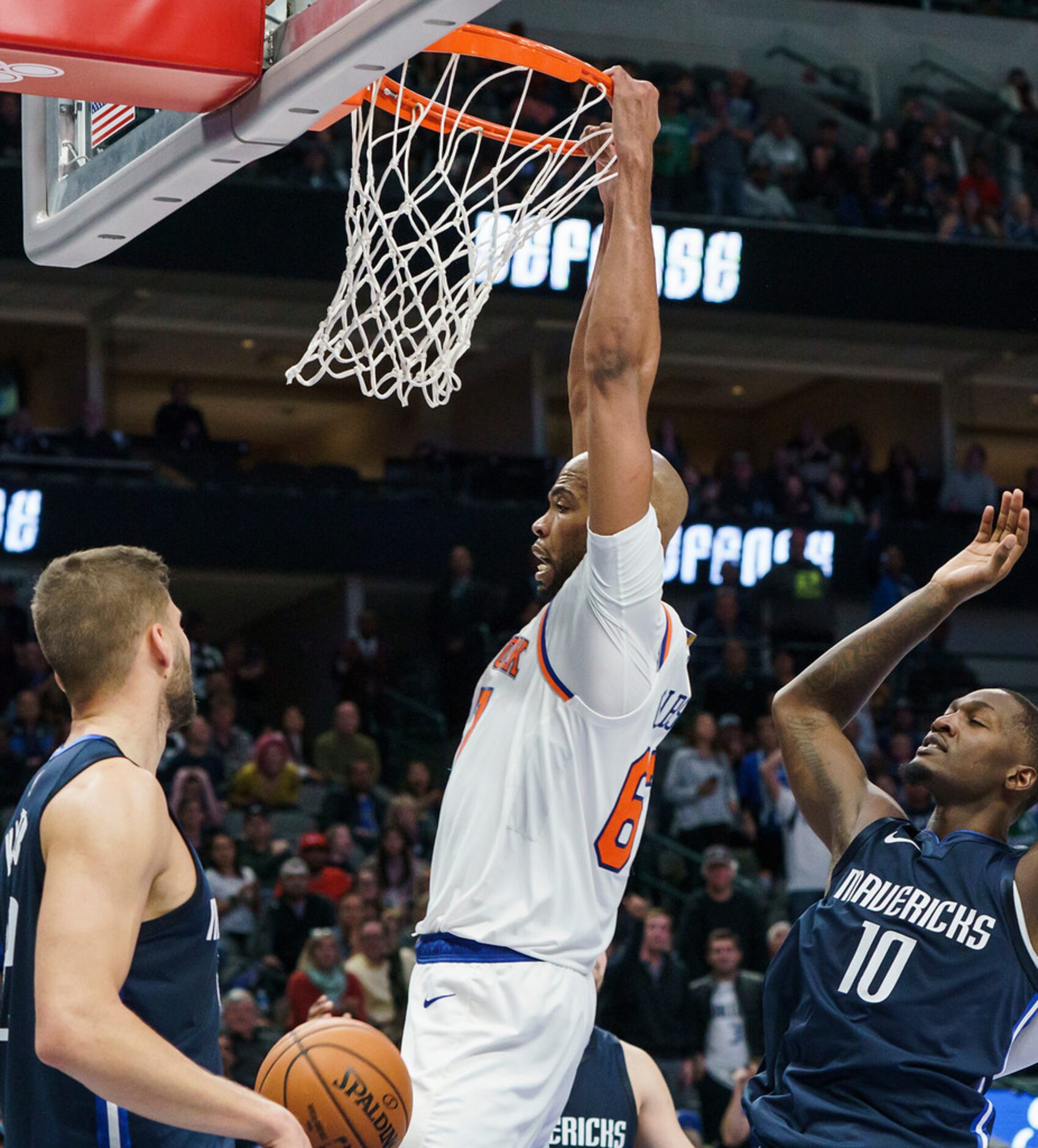 New York Knicks forward Taj Gibson (67) dunks the ball past Dallas Mavericks forward Dorian...