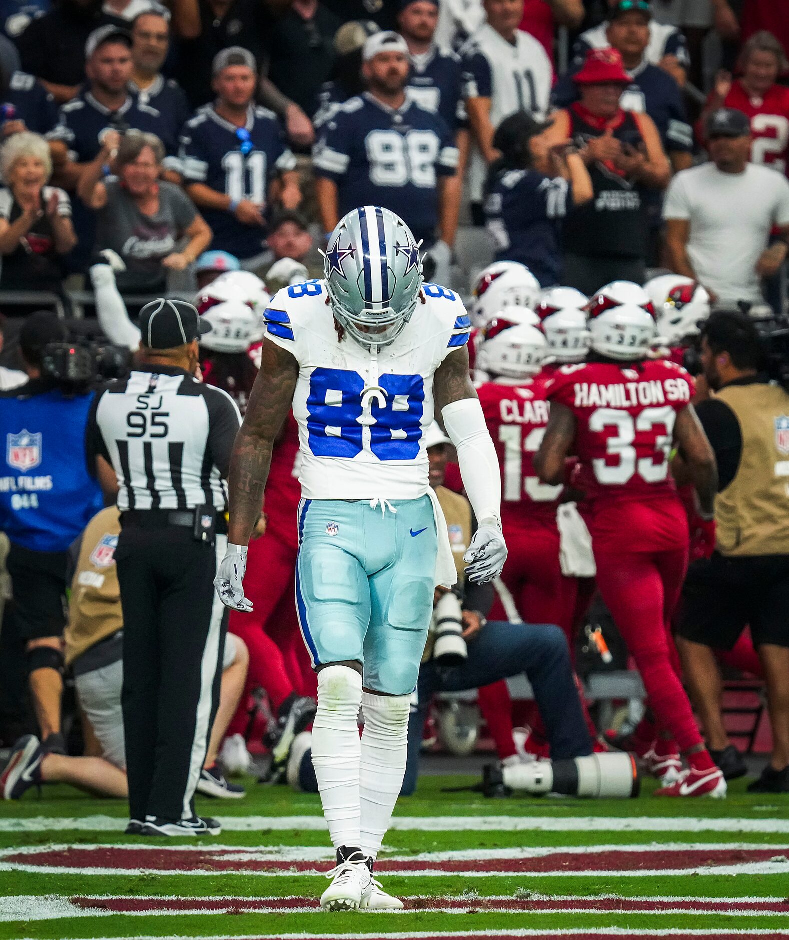 Dallas Cowboys wide receiver CeeDee Lamb (88) walks off the field as Arizona Cardinals...