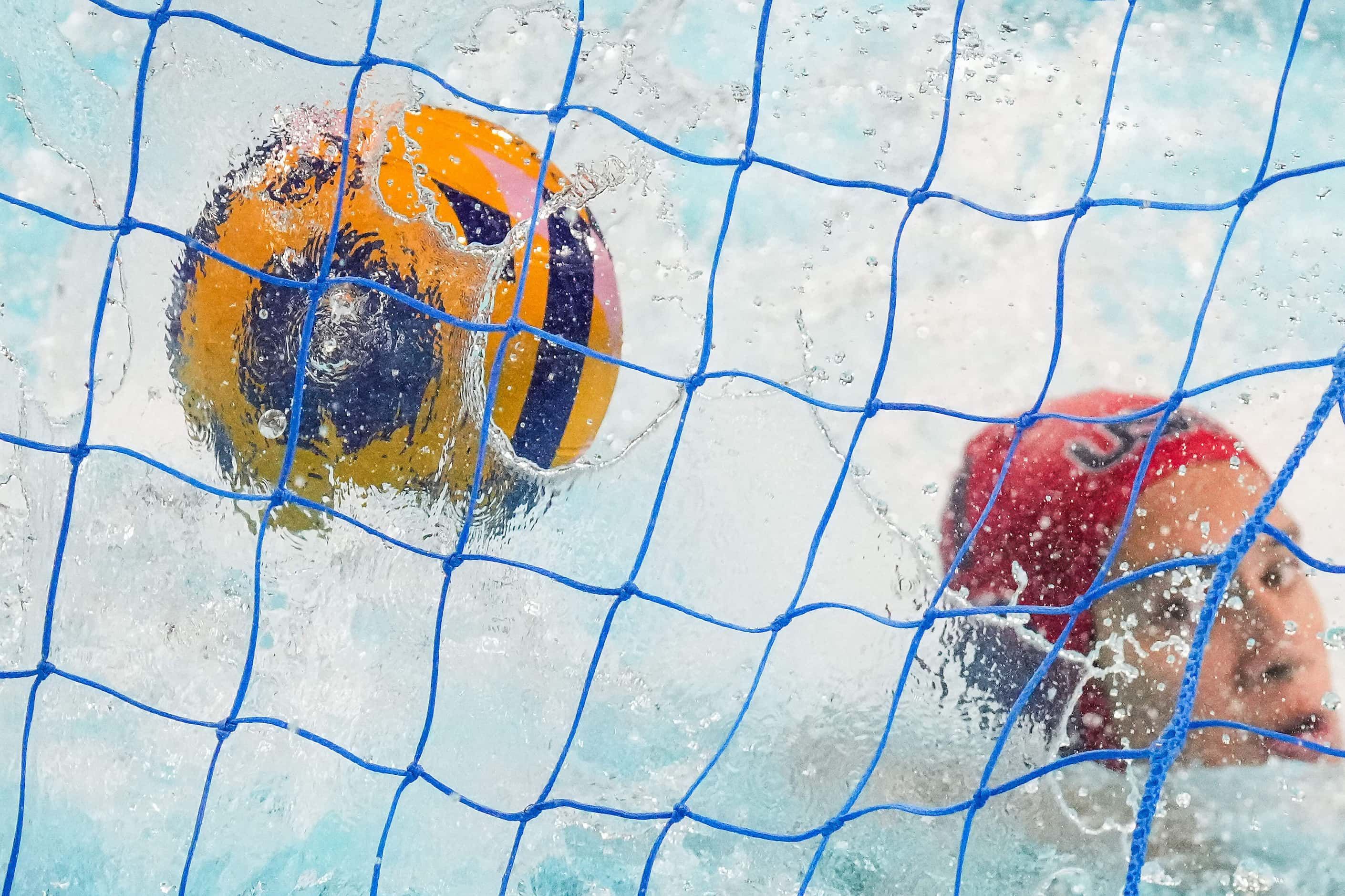 Goalkeeper  Adrian Weinberg of the United States watches a goal by Serbia go into the net...