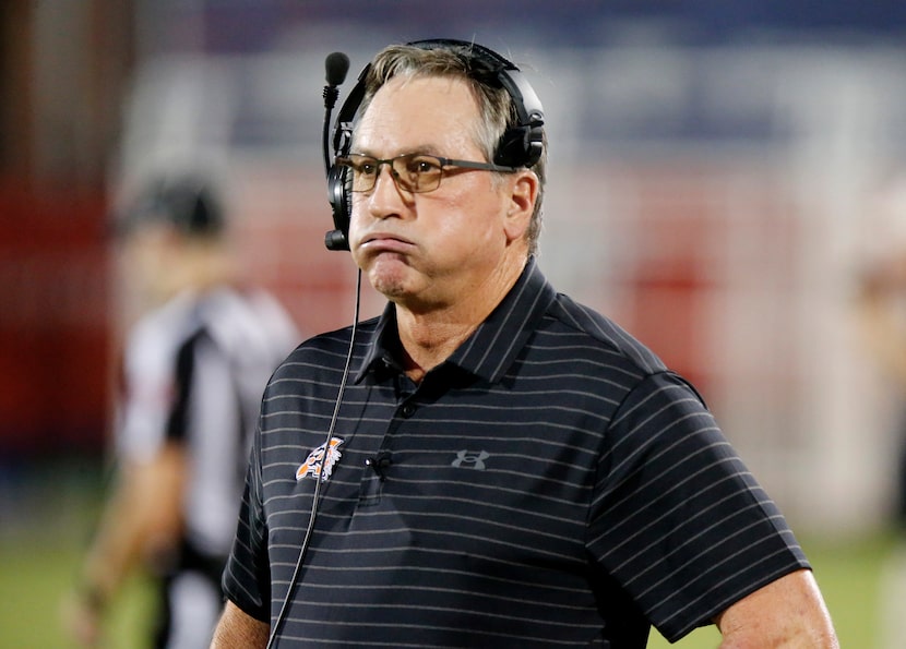 Aledo High School head coach Tim Buchanan looks on during the first half as Lone Star High...